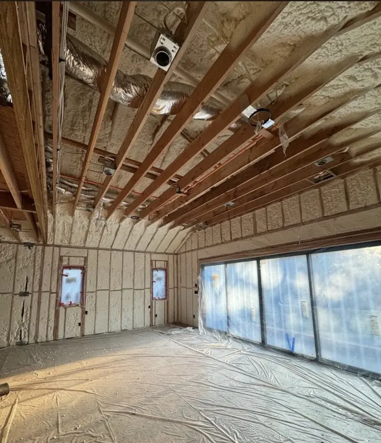 Interior walls and ceiling insulated with spray foam during new construction in Saginaw